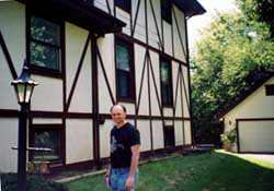 Mike beside the house